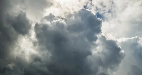 Time lapse clip of gray fluffy curly rolling clouds before storm Stock Footage 89904157