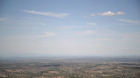 Time lapse clip of landscape with moving clouds on blue sky. Stock Footage 48976289