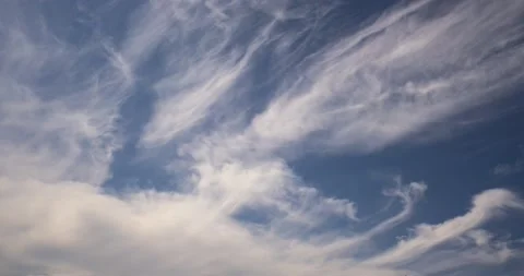 Time lapse clip of several fluffy curly rolling cloud layers Stock Footage 135611206