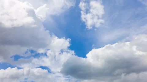 Time lapse clip of white fluffy clouds over blue sky Stock Footage 7340356