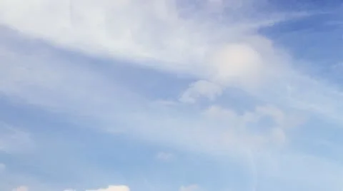 Time lapse clip of white fluffy clouds over blue sky Stock Footage 11121468