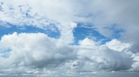 Time lapse clip of white fluffy clouds over blue sky Stock Footage 11887203