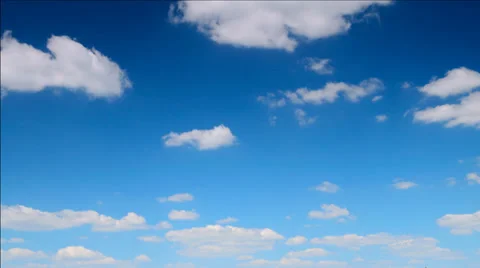 Time lapse clip of white fluffy clouds over blue sky Vídeos de archivo 27483694