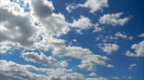 Time lapse clip of white fluffy clouds over blue sky Stock Footage 32325967