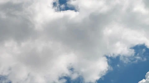 Time lapse clip of white fluffy clouds over blue sky Stock Footage 35502139