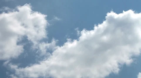 Time lapse clip of white fluffy clouds over blue sky 動画素材 35520345