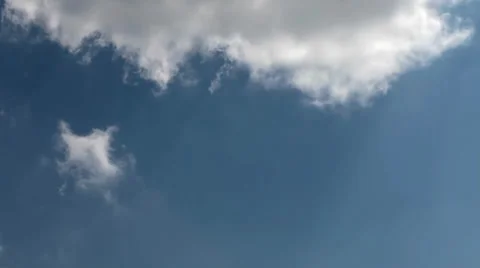 Time lapse clip of white fluffy clouds over blue sky Stock Footage 35520356