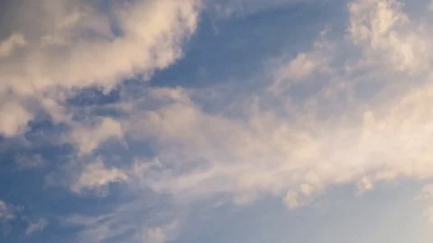 Time lapse clip of white fluffy clouds over blue sky Stock Footage 76593378