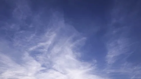 Time lapse clip of white fluffy clouds over blue sky Stock Footage 76688667