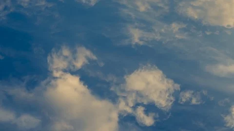 Time lapse clip of white fluffy clouds over blue sky Stock Footage 76727708