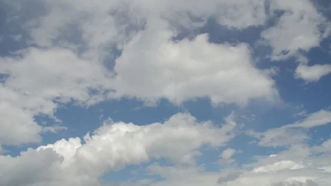 Time lapse clip of white fluffy clouds o... | Stock Video | Pond5