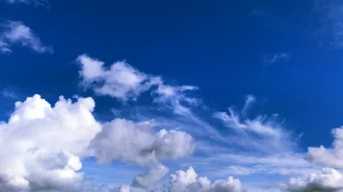 Time lapse clip of white fluffy clouds over blue sky Stock Footage 80356602