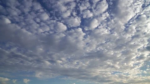 Time lapse clip of white fluffy clouds over blue sky Stock Footage 84234428