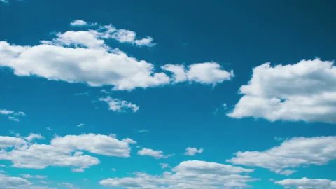 Time lapse clip of white fluffy clouds over blue sky 4K Stock Footage 91005711