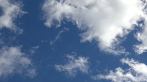 Time lapse clip of white fluffy clouds over sky Stock Footage 95796456
