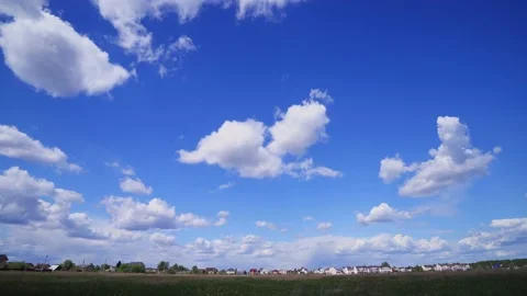 Time lapse clip of white fluffy clouds over blue sky. Puffy fluffy white clouds Stock Footage 130582521
