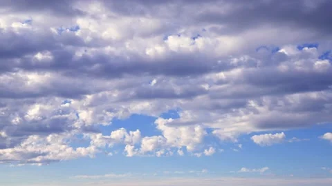 Time lapse clip of white fluffy clouds over blue sky. Puffy fluffy white clouds Stock Footage 134466974
