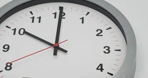 Time-lapse clock with black arrows shows time 10.00 speed up and slow to 11.00 Stock Footage 120942027