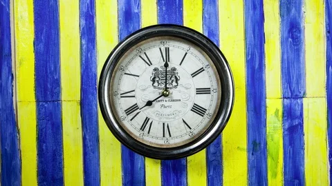 Time lapse clock - camera rotates with big hand of a clock from 08:00-09:00 Stock Footage 94776348