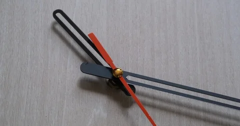 Time lapse of clock on wooden background and movement of clock hands Stock Footage 120107393