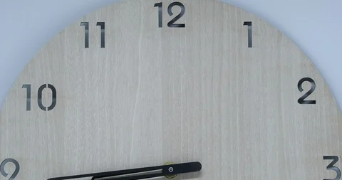 Time-lapse of clock on wooden background and movement of clock hands Stock Footage 120108398