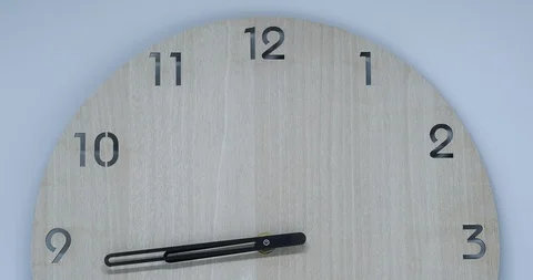 Time-lapse of clock on wooden background and movement of clock hands Stock Footage 120108416