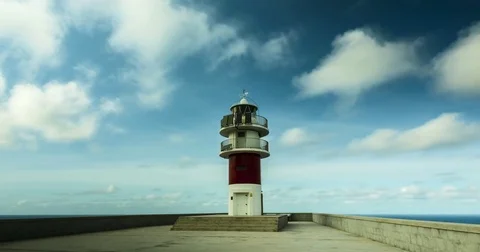 Time lapse with close up of lighthouse with drifting clouds. Stock Footage 77916680