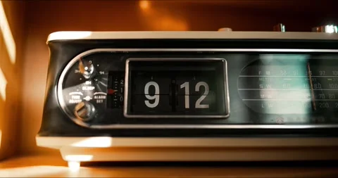 Time lapse close up of retro flip clock with moving sunlight and shadows Stock Footage 345815696
