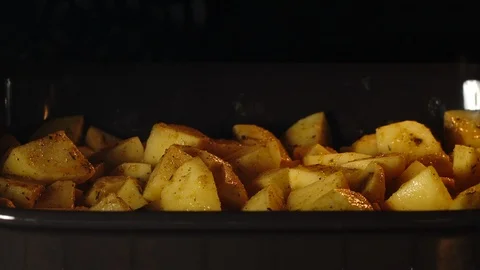 TIME-LAPSE: Close shot of cooking fried potatoes in the oven Stock Footage 107932841