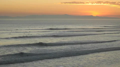 Time lapse close up of surfers and waves at Ventura Point at sunset in Ventura Stock Footage 1019435
