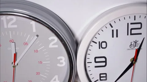 Time Lapse Close Up Of Two Clocks With Red Second Hand On White Background Stock Footage 337810059