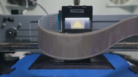 A time-lapse of a closeup view of a 3D printer in a printing process. Stock Footage 110719497