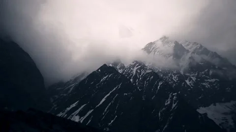 Time-lapse Cloud and mist moving cover around mountain and mountain covered snow Stock Footage 154019865