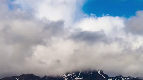 Time lapse of cloud covered mountain peak Stock Footage 75008581