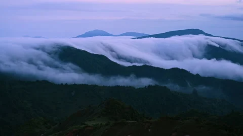 Time-lapse of cloud flowing over the mountain in the overcast Stock Footage 137101081