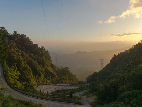 Time Lapse: The cloud movement and also the car moving down hill Stock Footage 72355579