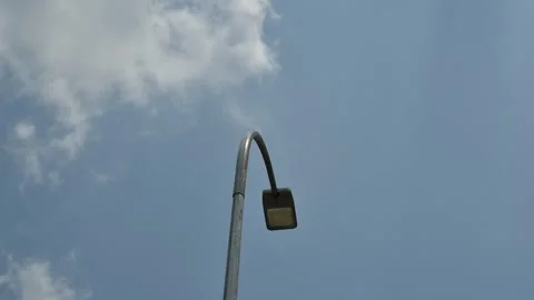 Time lapse cloud movement, focus on street lights Stock Footage 253420965