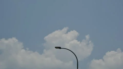 Time lapse cloud movement, focus on street light Stock Footage 253420967