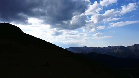 Time Lapse cloud movement with mountain range. Stock Footage 128166445