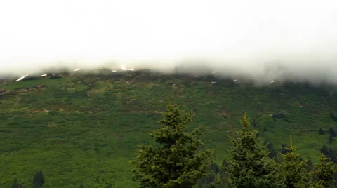 Time-lapse of cloud movement over a green hillside near Seward, Alaska. Stock Footage 52216707
