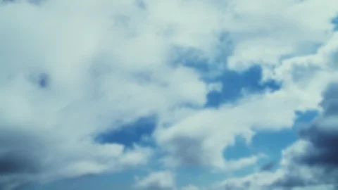 Time-lapse cloud moving away from the abstract blurred background. 4K Stock Footage 121497094