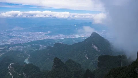 Time Lapse of Cloud Sea Over City Distant Mountain Peak Forest Panorama Stock Footage 337930651