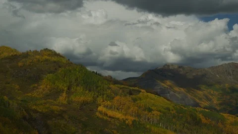 Time lapse of cloud shadows on autumn trees in the Colorado Rocky Mountains Stock Footage 108548889
