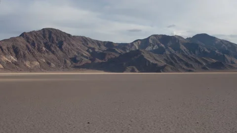 Time lapse of cloud shadows moving across the desert Racetrack in Death Valley Stock Footage 147518212