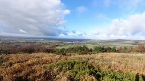 Time lapse cloud shadows passing across lush patchwork British farmland Video stock 142605296