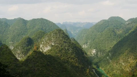 Time lapse of cloud shadows running over beautiful karst hills of China Stock Footage 71391409