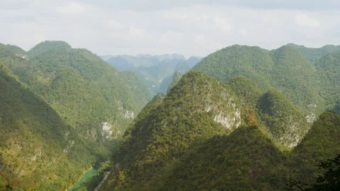 Time lapse of cloud shadows running over beautiful karst hills of China Stock Footage 71391676