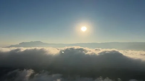 Time-lapse of Cloud Waterfall Flowing Over Mountain Ridge at Sunrise in Chin Stock Footage 327765072