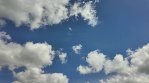 Time lapse clouds 4k rolling puffy cumulus cloud relaxation weather dramatic Video stock 306599315