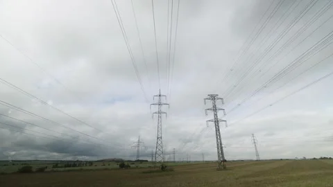 Time lapse of clouds above electricity pylons of power line Stock Footage 249399167